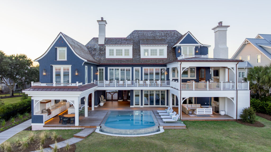 Hamptons-style waterfront home in Wilmington, NC, viewed from the waterfront side.