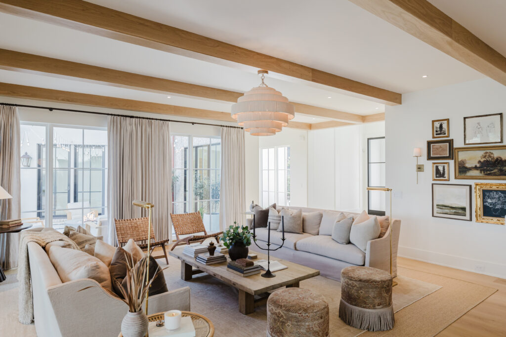 The main living space at La Paloma reflects a functional and relaxed aesthetic, ready for entertainment or relaxation. Design choices are rooted in organic materials and tonal richness. Lime-washed walls, plastered range hoods, and European oak floors pair with antique lighting and custom ironwork, curating a space that is both luxurious and welcoming. The palette is warm and natural, allowing texture and craftsmanship to glow.